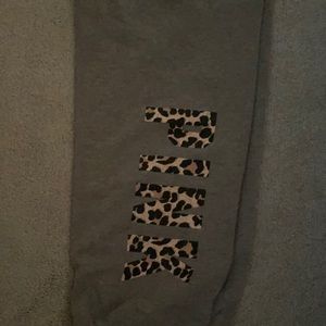 Grey pink sweats with cheetah print writing